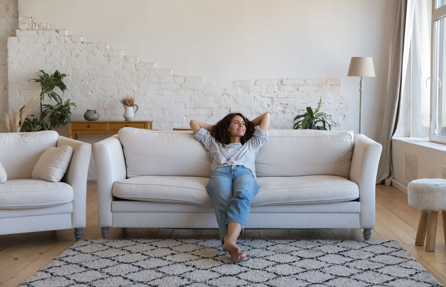 Person sat on a sofa chilling